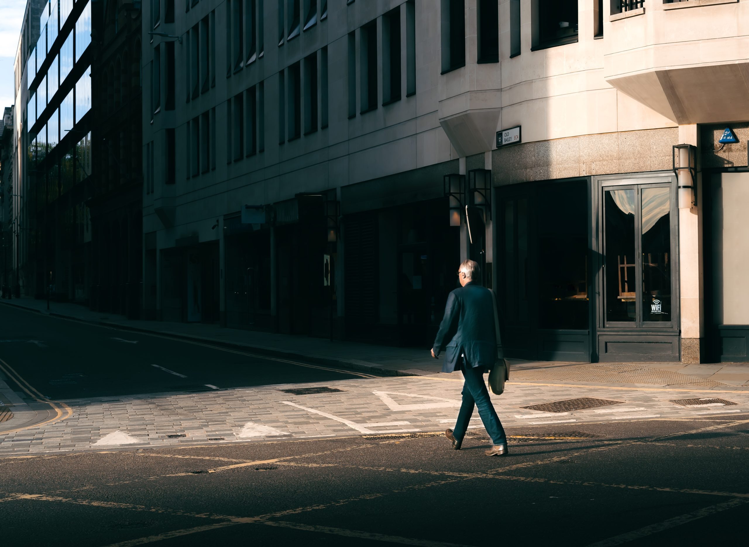 Street,Photo,Of,Man,Walking,Across,The,Road,In,Shaft